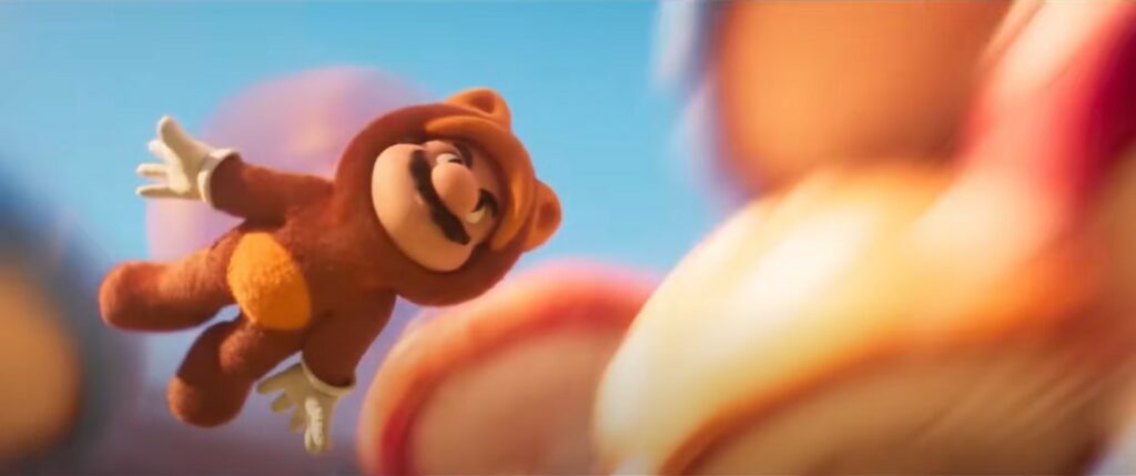 Extrait de la première bande-annonce du film Super Mario Bros. - Mario en costume Tanuki volant au milieu des champignons